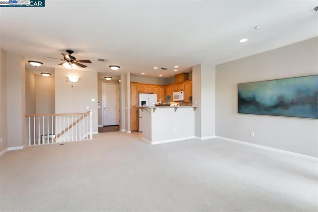 a view of empty room with fireplace