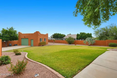 a view of a garden with a house
