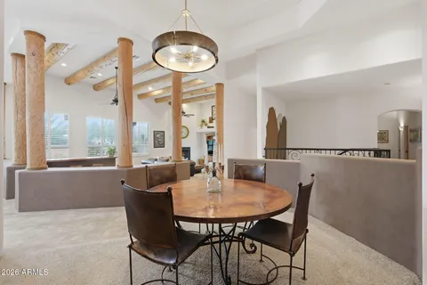 a view of a dining room with furniture window and outside view