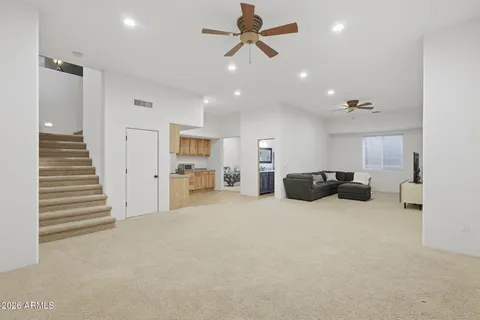 a large room with chandelier and couches