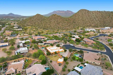 an aerial view of residential houses with outdoor space