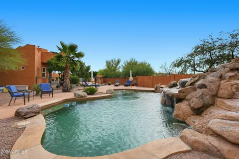 a view of swimming pool with outdoor seating