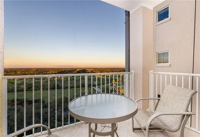 a view of a chairs and table in patio