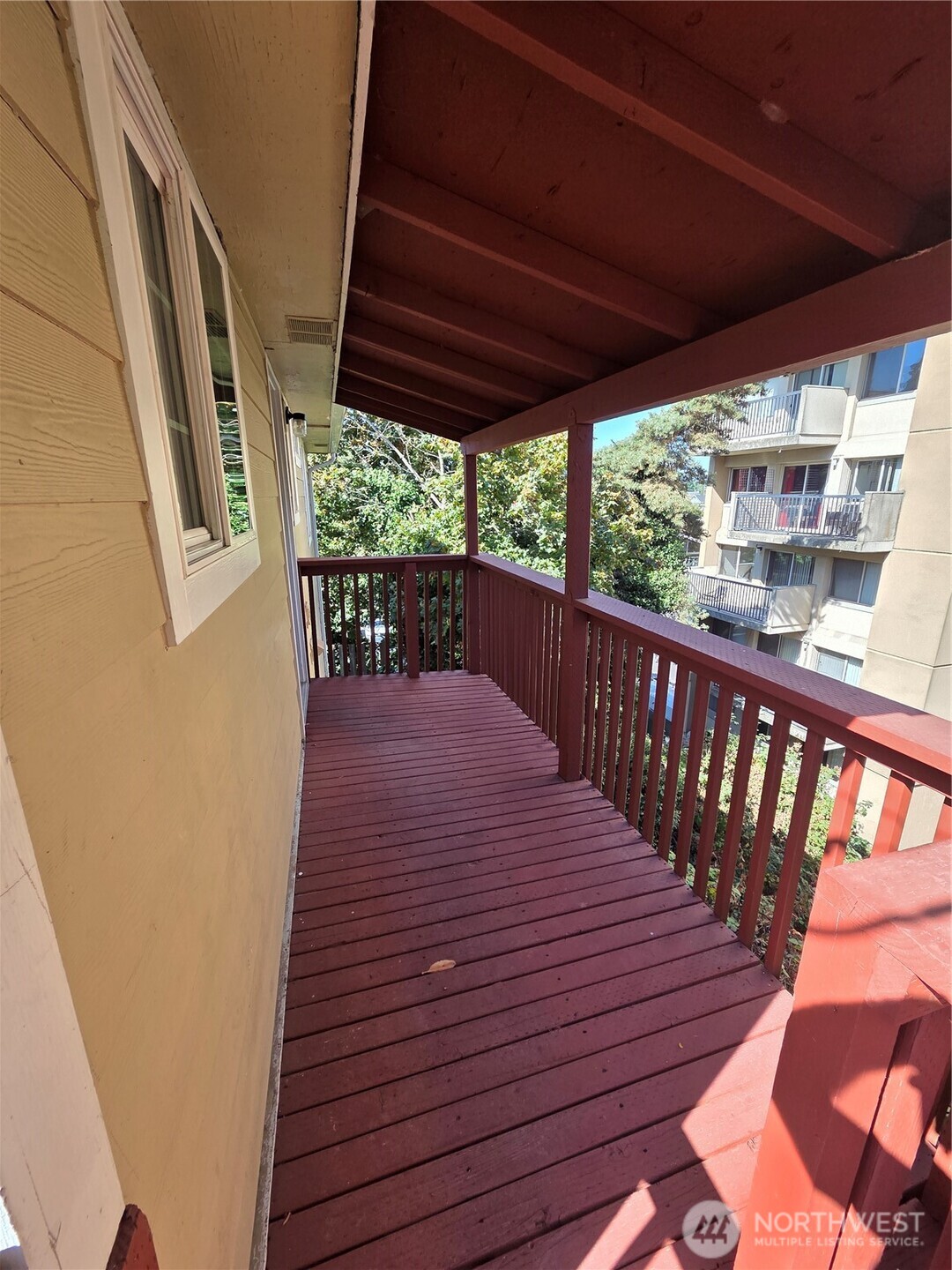 10603 12th Avenue Southwest Seattle, WA 98146 - Photo 9 of 14 a balcony with wooden floor