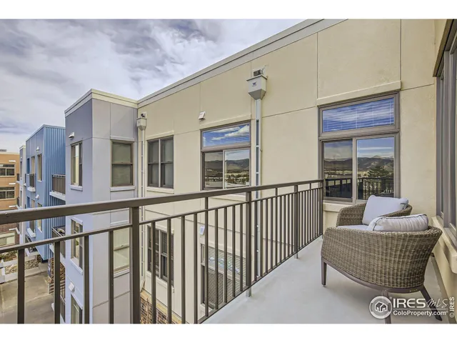 a balcony with furniture and window