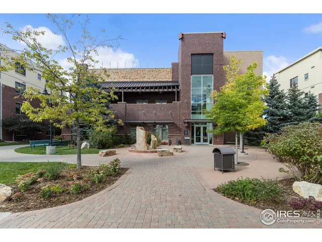 a view of a house with backyard and a garden