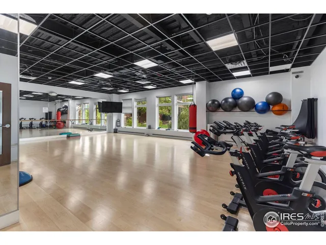 a room with lots of furniture and a chandelier