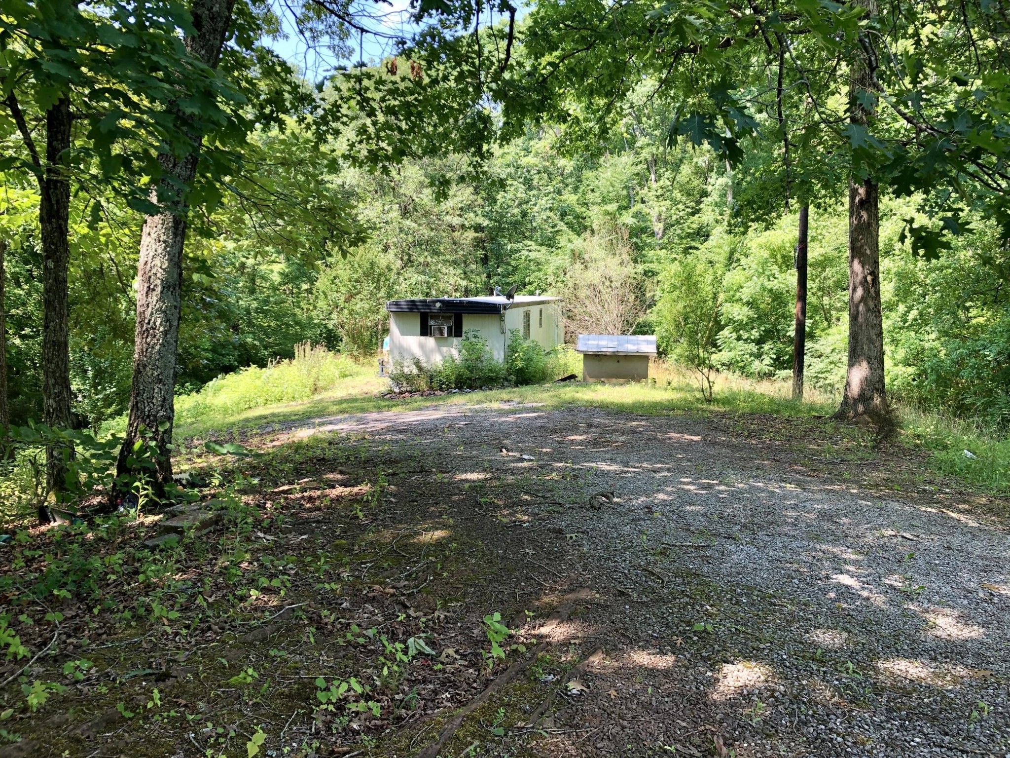 1622 Elkins Road Kodak, TN 37764 - Photo 1 of 11 a view of a house with large trees