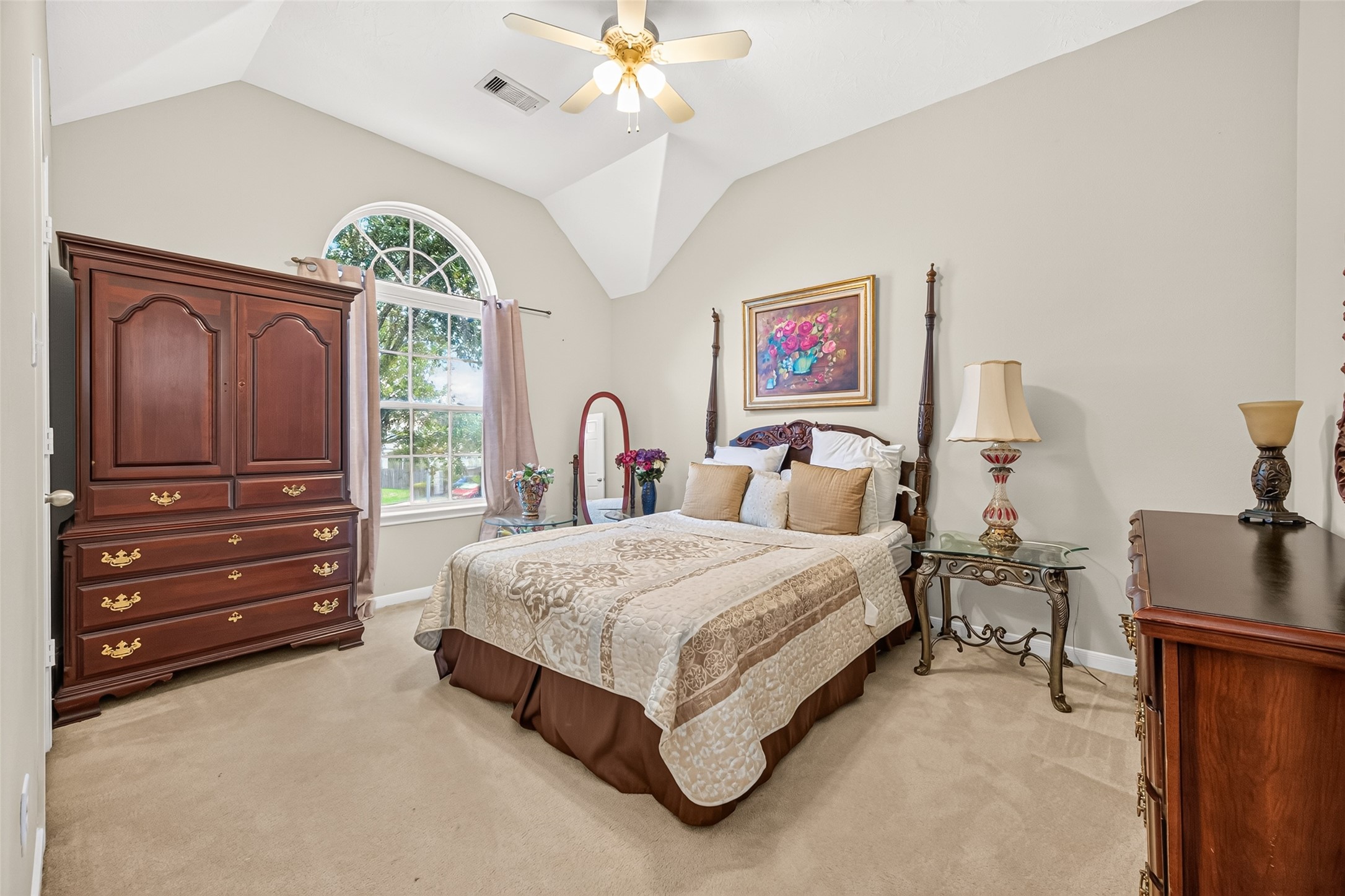 22007 Bridgestone Hawk Court Spring, TX 77388 - Photo 40 of 50 A lovely arched window adds character to this well-sized carpeted bedroom, complemented by a ceiling fan and a layout that leaves room for comfortable furnishings.