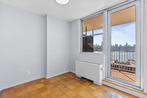 a view of a bedroom with a large window