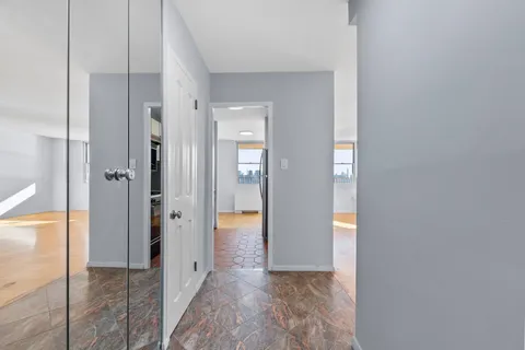 wooden floor with white walls