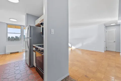 a view of a kitchen from the hallway