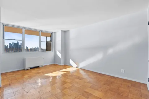 a view of an empty room with a window