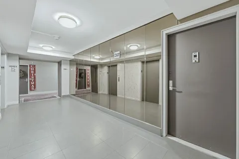 a dining room with furniture and a potted plant
