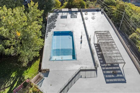 a view of a swimming pool and an outdoor space
