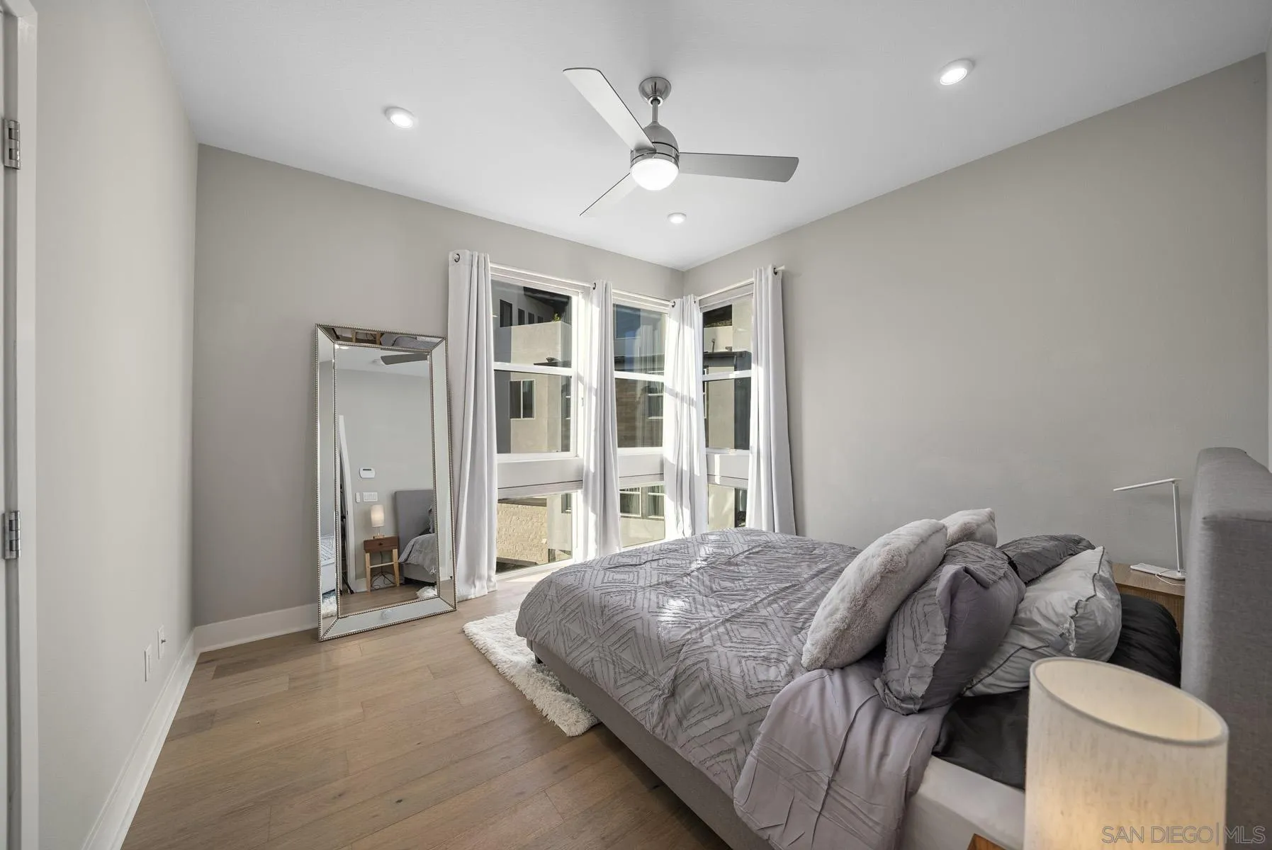 2854 Avella Circle San Diego, CA 92108 - Photo 13 of 31 a spacious bedroom with a bed and a large window
