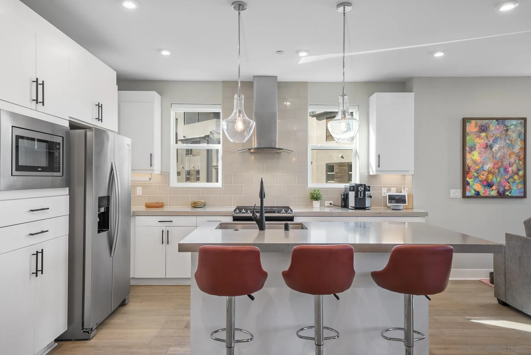 2854 Avella Circle San Diego, CA 92108 - Photo 3 of 31 a kitchen with stainless steel appliances granite countertop a refrigerator a sink a stove a dining table and chairs