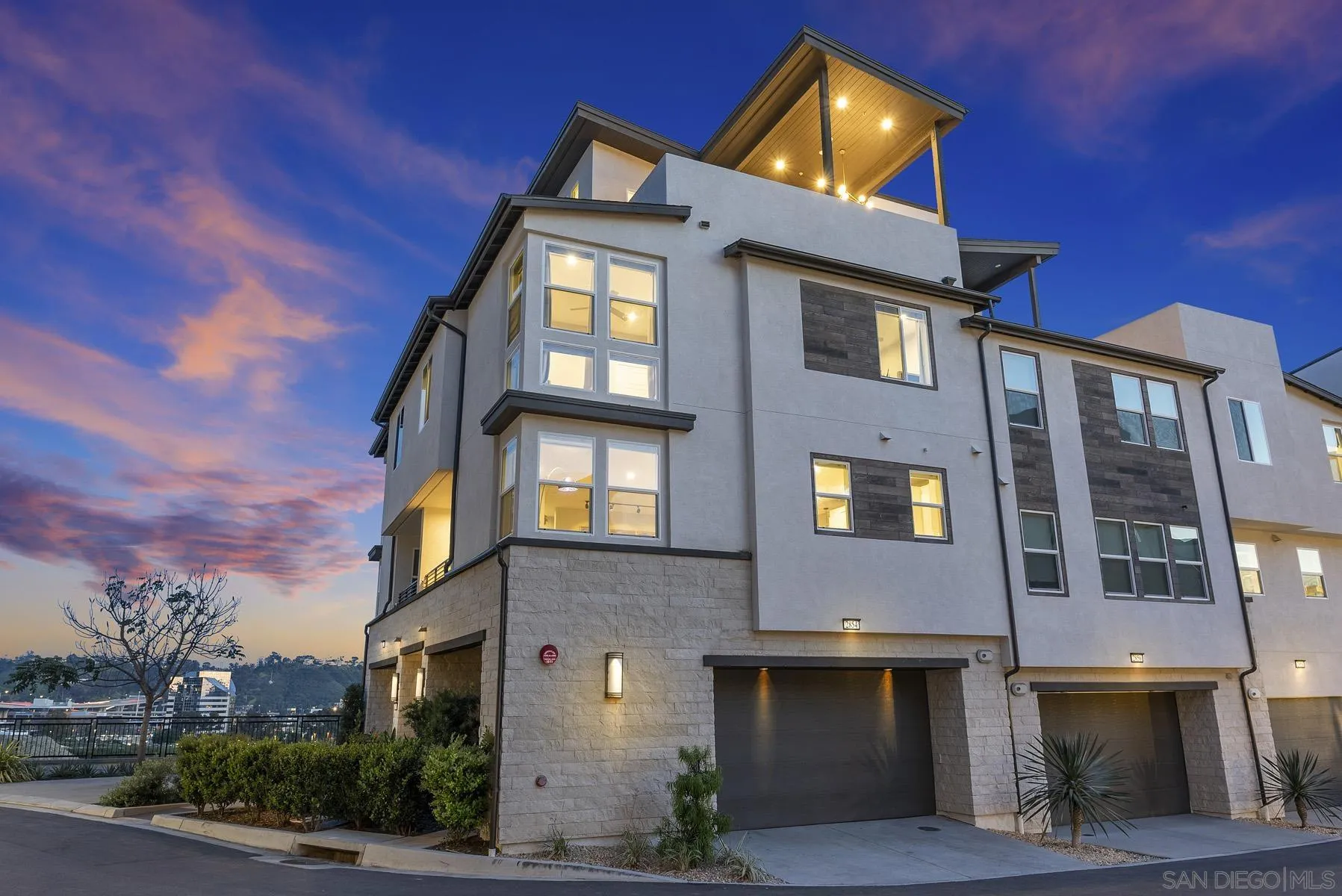 2854 Avella Circle San Diego, CA 92108 - Photo 31 of 31 a front view of a residential apartment building with a yard