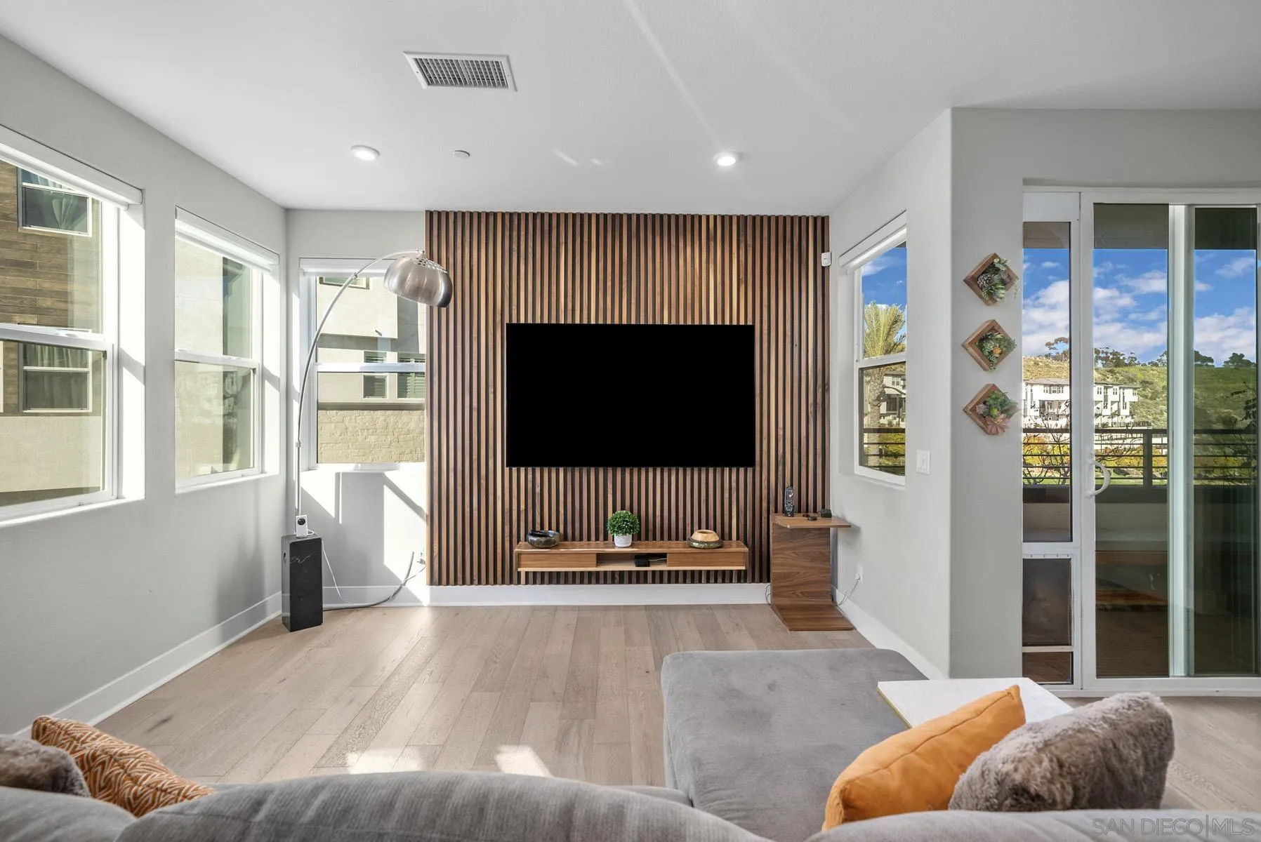 2854 Avella Circle San Diego, CA 92108 - Photo 4 of 31 a living room with furniture and a flat screen tv