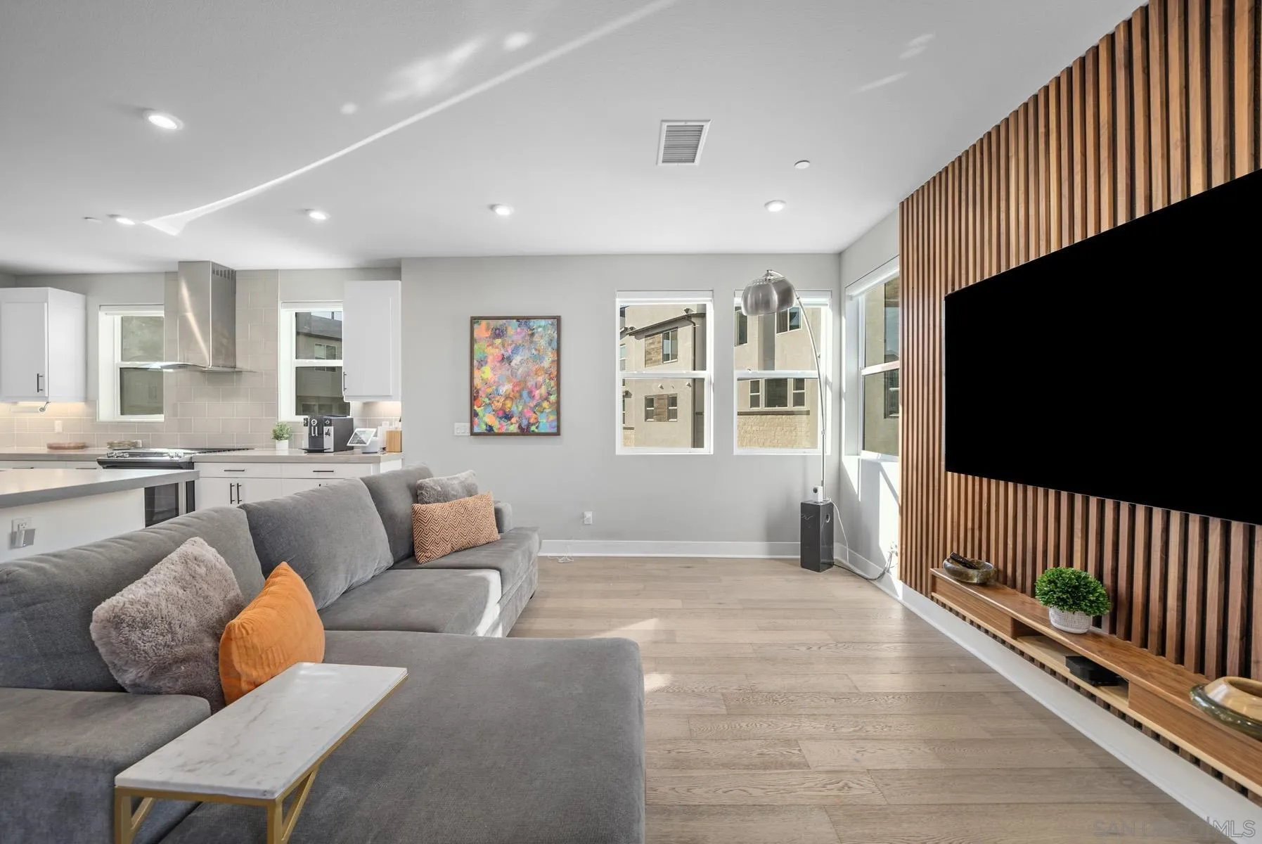 2854 Avella Circle San Diego, CA 92108 - Photo 5 of 31 a living room with furniture and a flat screen tv