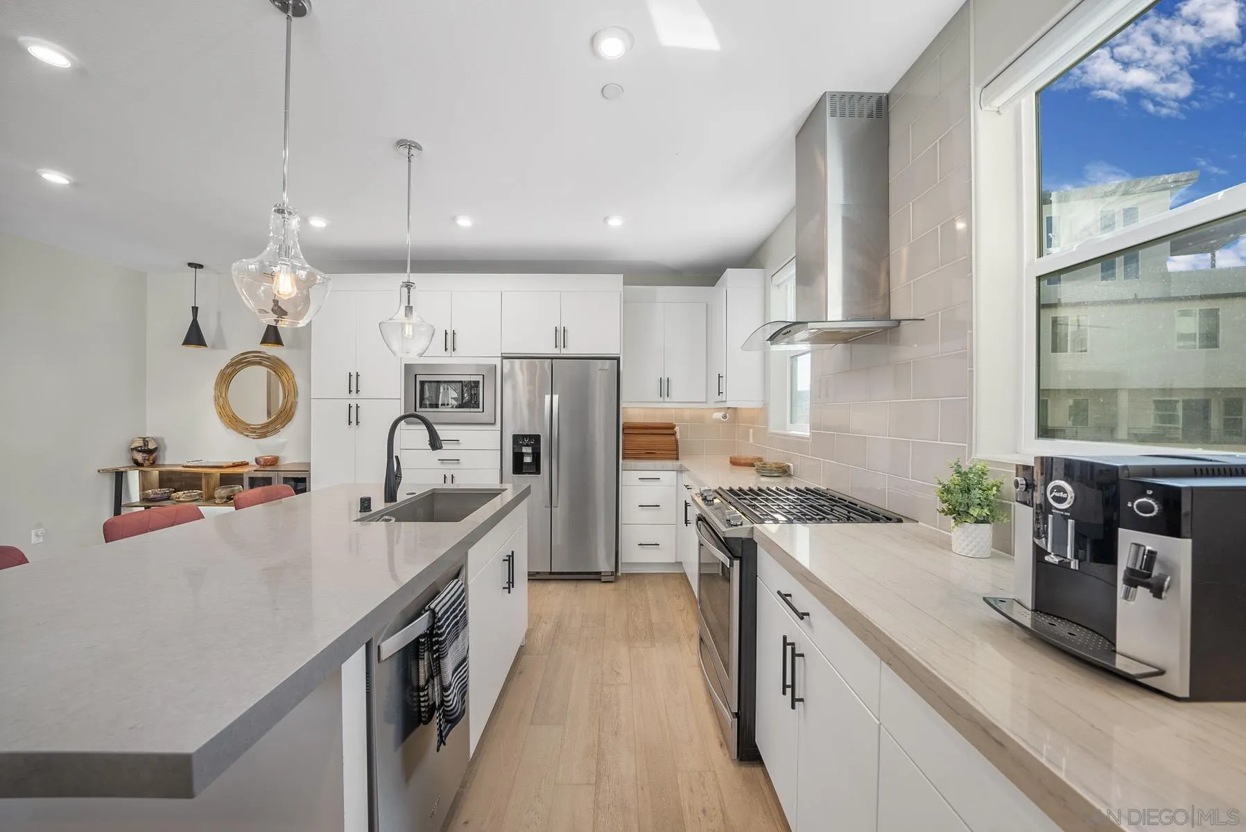 2854 Avella Circle San Diego, CA 92108 - Photo 9 of 31 a kitchen with stainless steel appliances granite countertop a sink stove and refrigerator