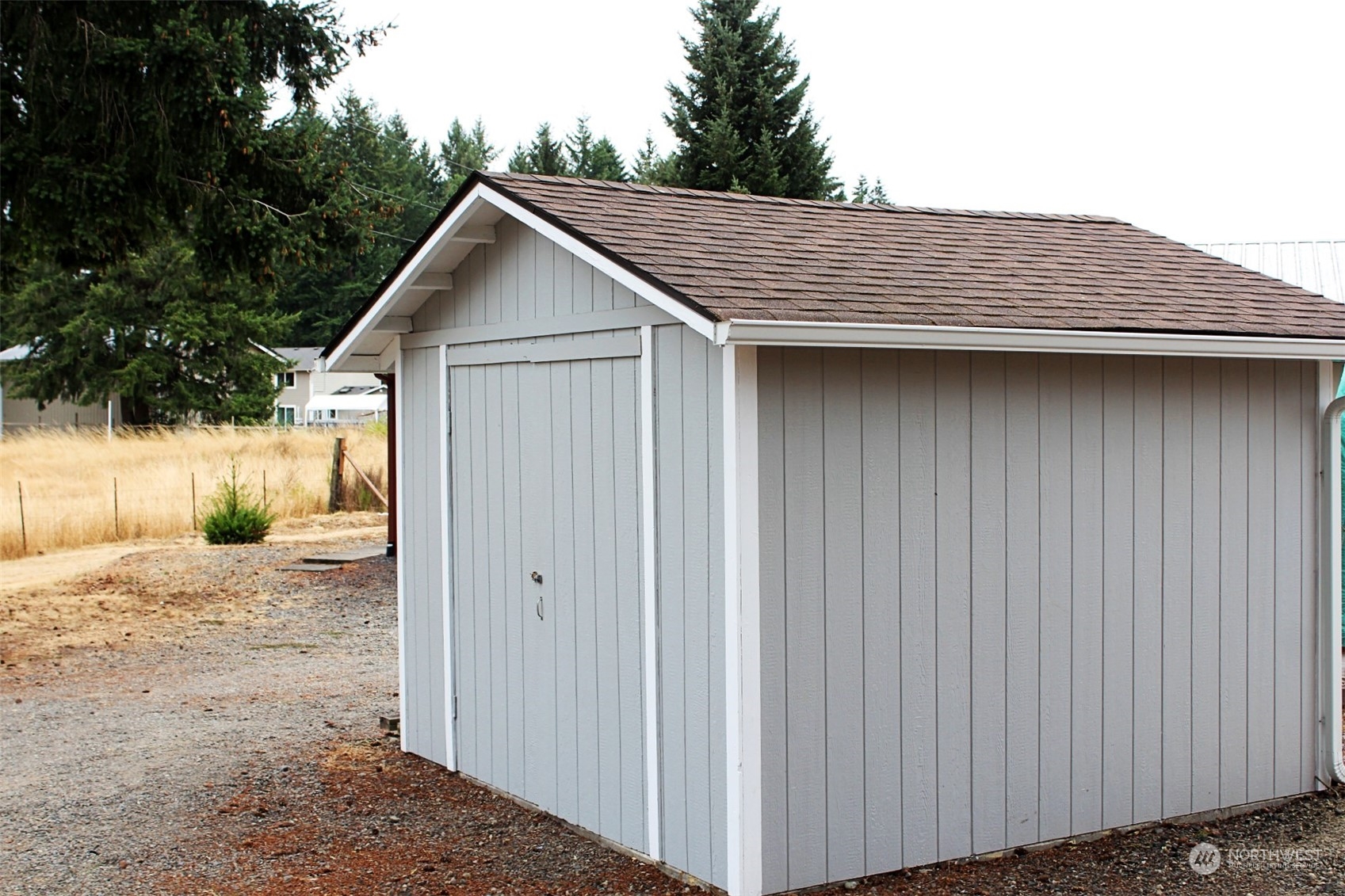 18334 Citrus Street Southwest Rochester, WA 98579 - Photo 27 of 30 a yellow house with a outdoor space