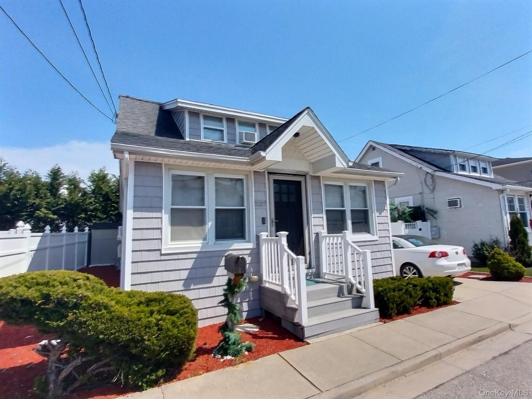 a front view of a house with a porch