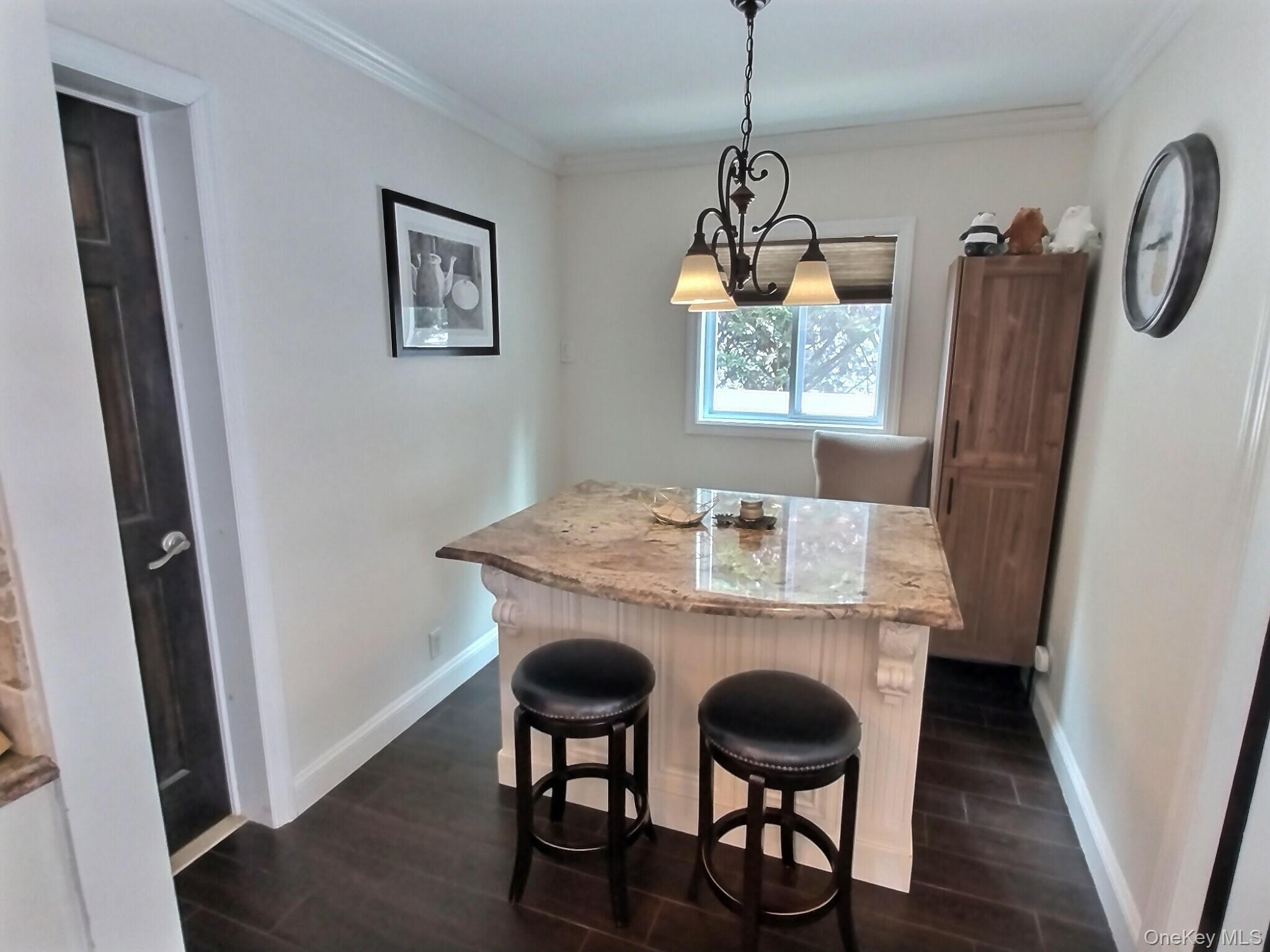 3037 Morrow Road Oceanside, NY 11572 - Photo 16 of 38 a view of a dining room with furniture and wooden floor