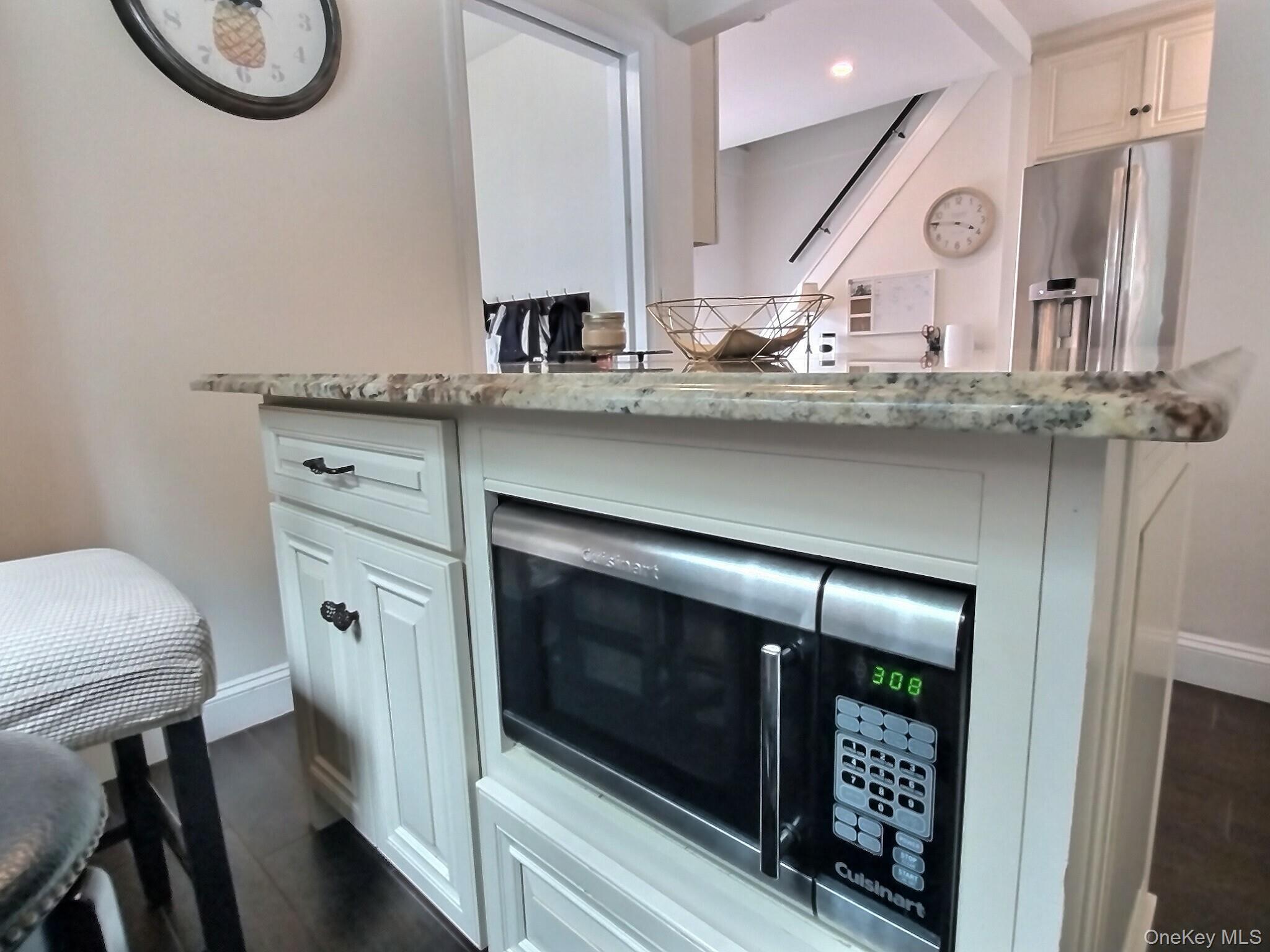 3037 Morrow Road Oceanside, NY 11572 - Photo 20 of 38 a kitchen with stainless steel appliances a stove a sink and cabinets
