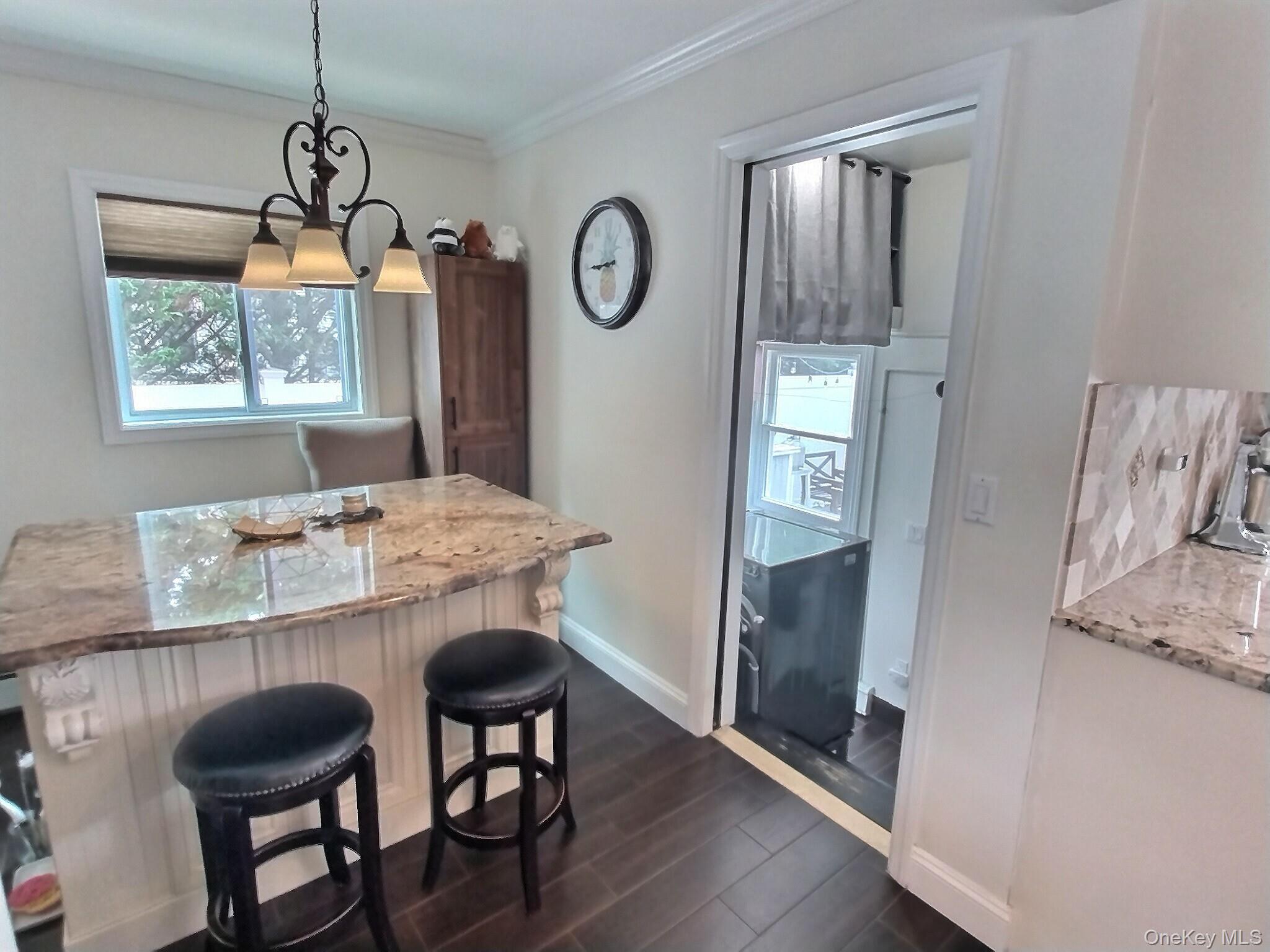 3037 Morrow Road Oceanside, NY 11572 - Photo 21 of 38 a view of a dining room with furniture window and wooden floor