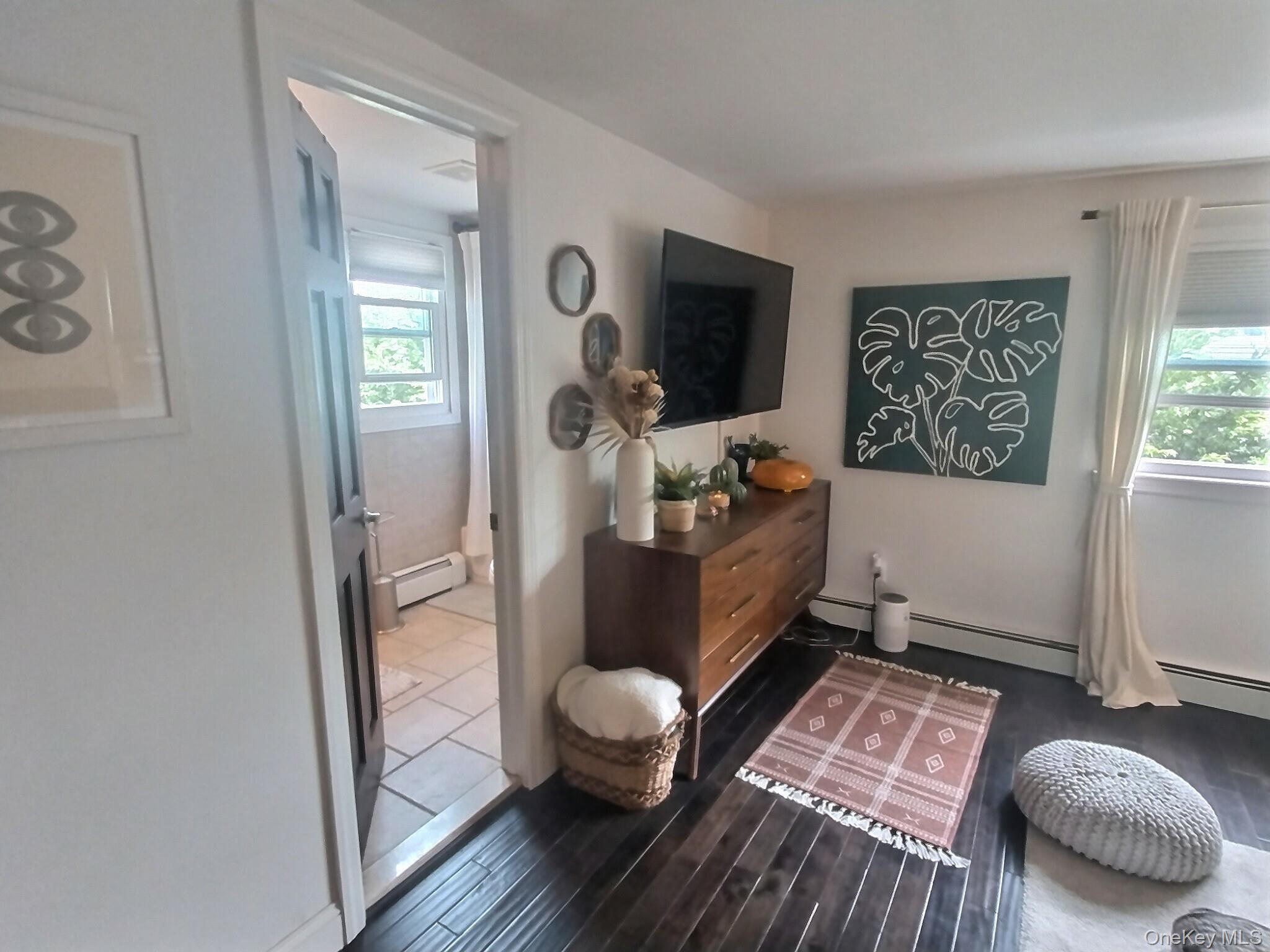 3037 Morrow Road Oceanside, NY 11572 - Photo 26 of 38 a living room with furniture and a flat screen tv