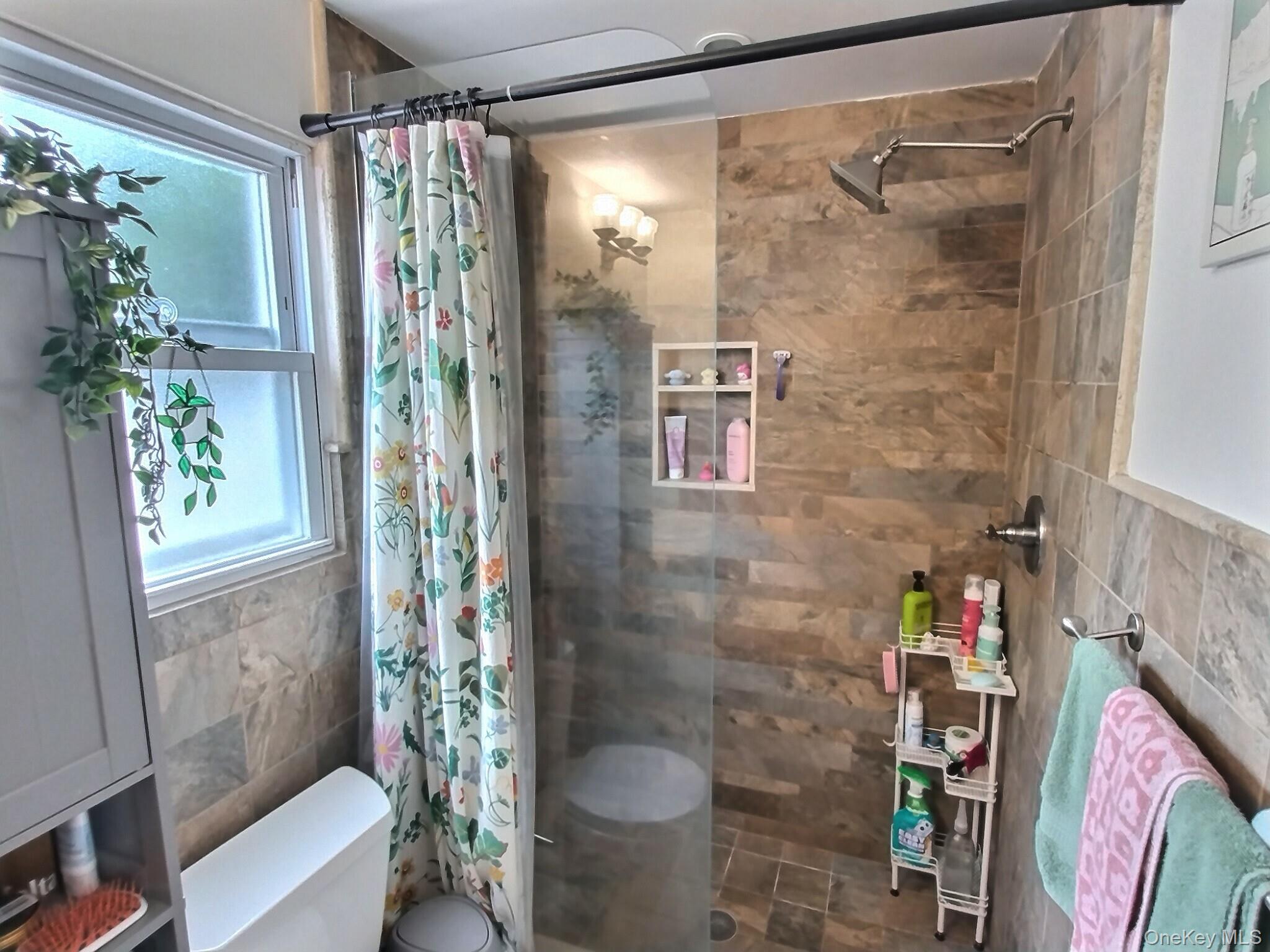 3037 Morrow Road Oceanside, NY 11572 - Photo 35 of 38 a bathroom with a shower and a toilet