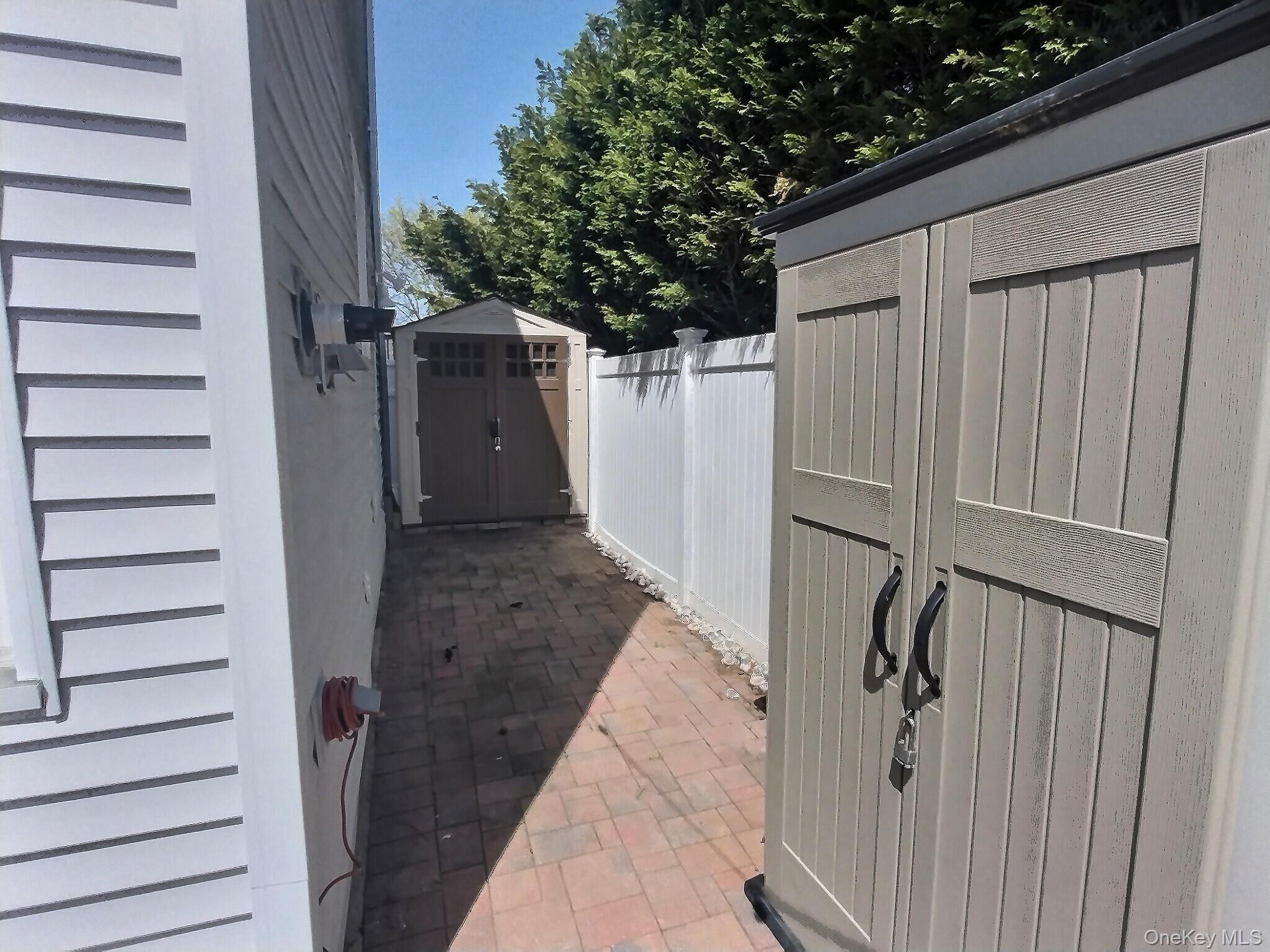 3037 Morrow Road Oceanside, NY 11572 - Photo 38 of 38 a view of a house with a door