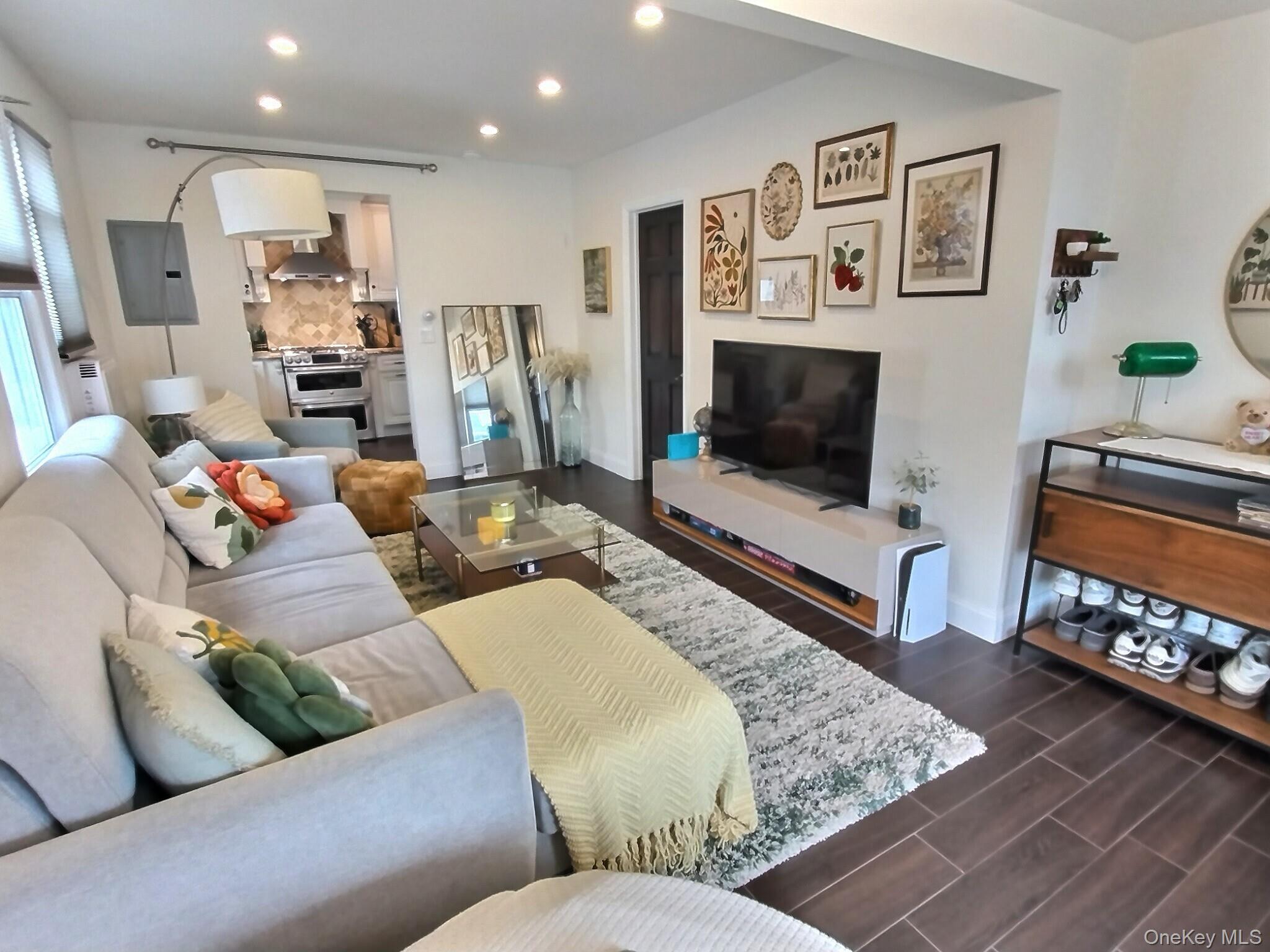 3037 Morrow Road Oceanside, NY 11572 - Photo 7 of 38 a living room with furniture and a flat screen tv