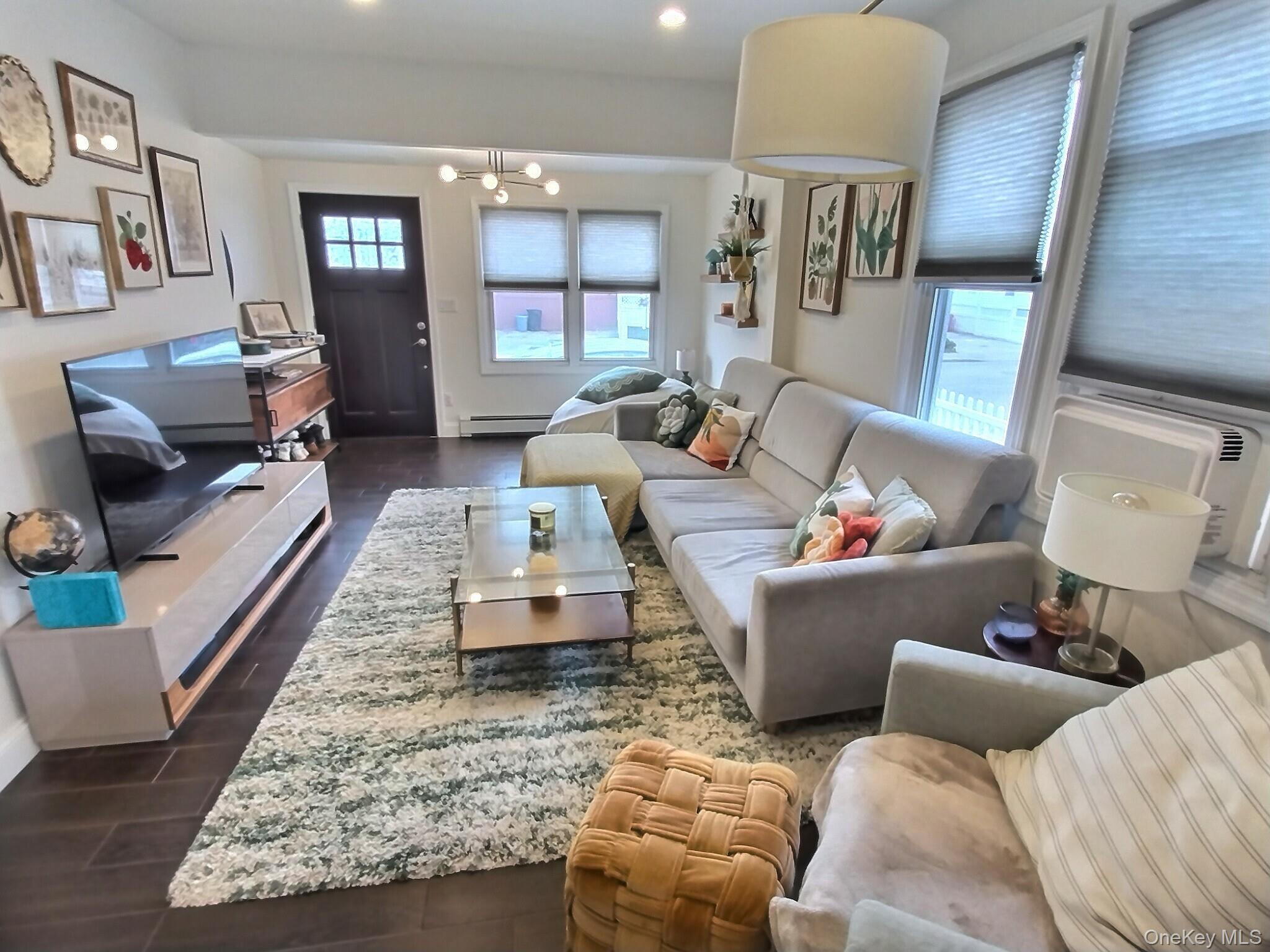 3037 Morrow Road Oceanside, NY 11572 - Photo 8 of 38 a living room with furniture and wooden floor