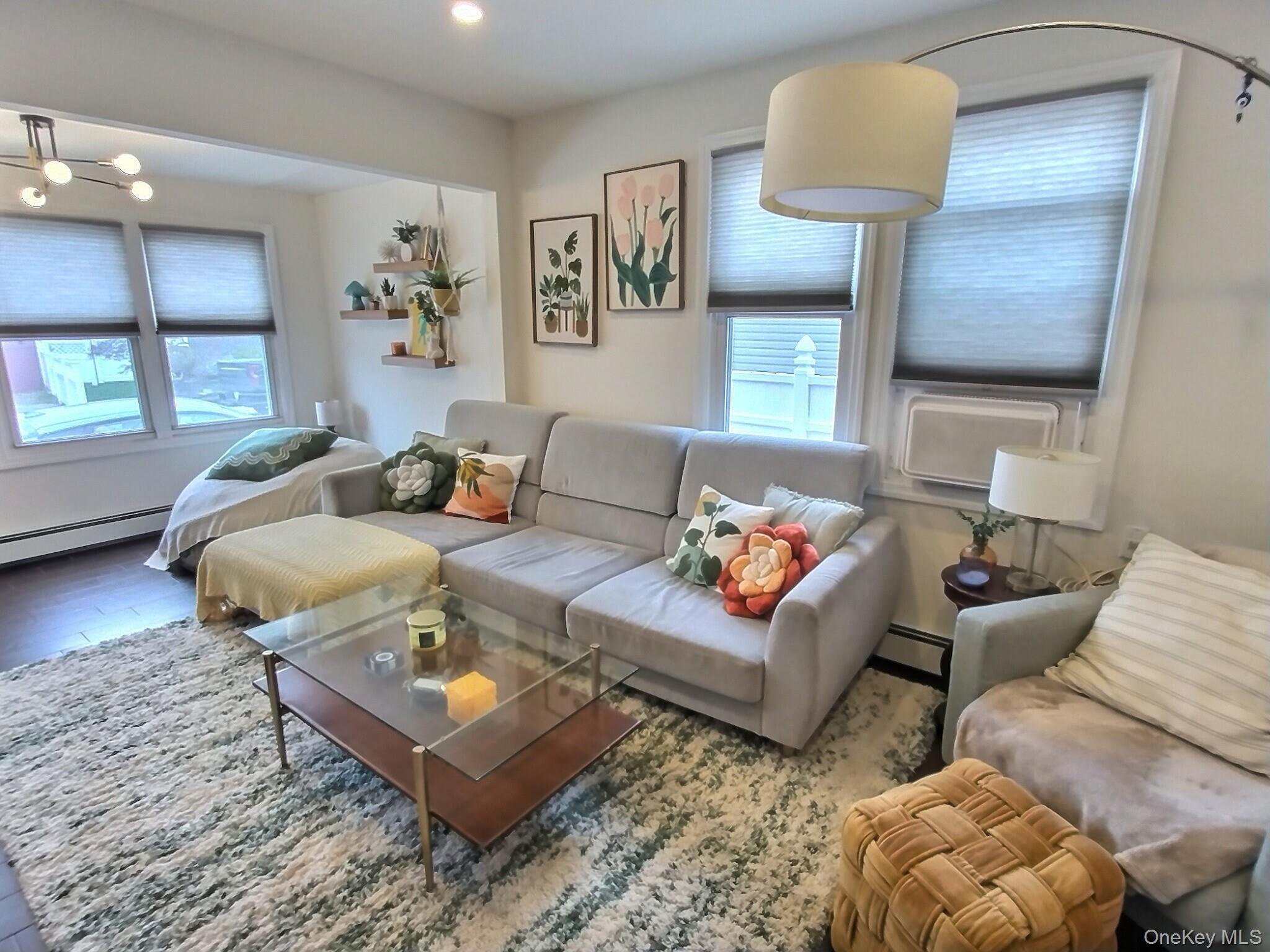 3037 Morrow Road Oceanside, NY 11572 - Photo 10 of 38 a living room with furniture and a wooden floor