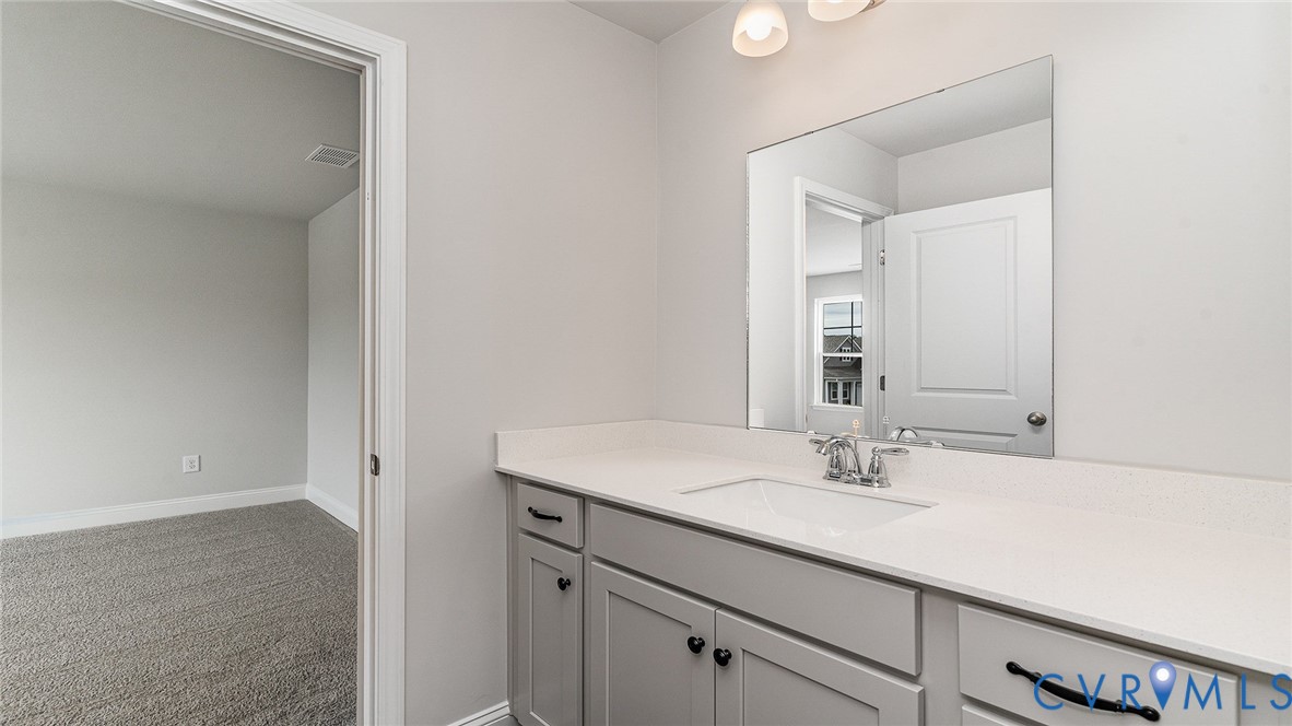 16806 Barmer Road Chesterfield, VA 23832 - Photo 24 of 39 a bathroom with a sink and a mirror