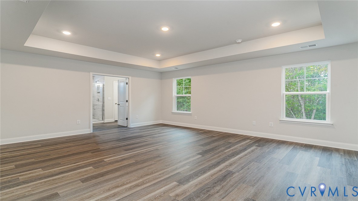 16806 Barmer Road Chesterfield, VA 23832 - Photo 30 of 39 an empty room with wooden floor and windows
