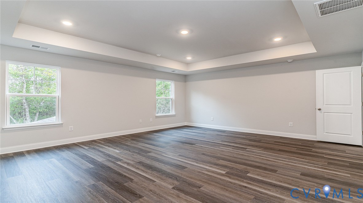 16806 Barmer Road Chesterfield, VA 23832 - Photo 31 of 39 an empty room with wooden floor and windows
