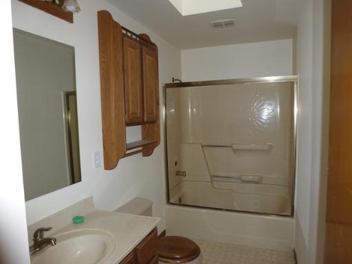 612 Springbrook Drive Aurora, IL 60506 - Photo 4 of 7 a bathroom with a bathtub and a shower