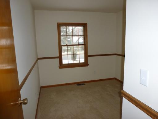 612 Springbrook Drive Aurora, IL 60506 - Photo 5 of 7 an empty room with windows