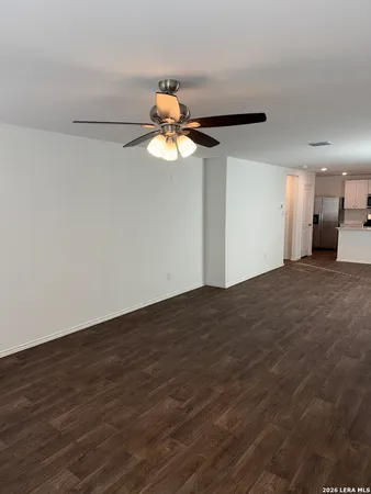 a view of a room with wooden floor