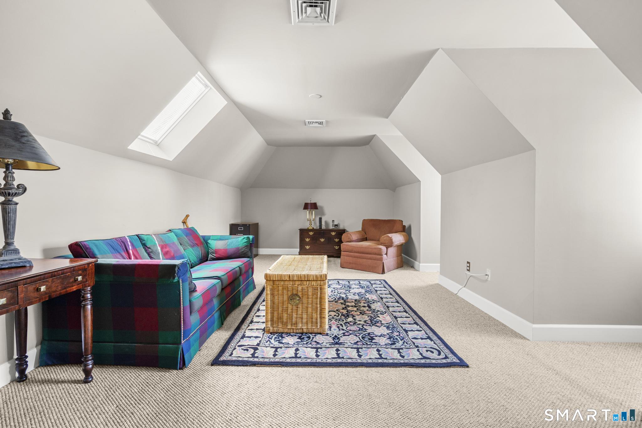 130 Stillson Road, Unit 130 Fairfield, CT 06825 - Photo 24 of 38 Third Bedroom on Second Level is spacious and currently staged as a den. Features ensuite jack-and-jill bathroom and walk-in-closet