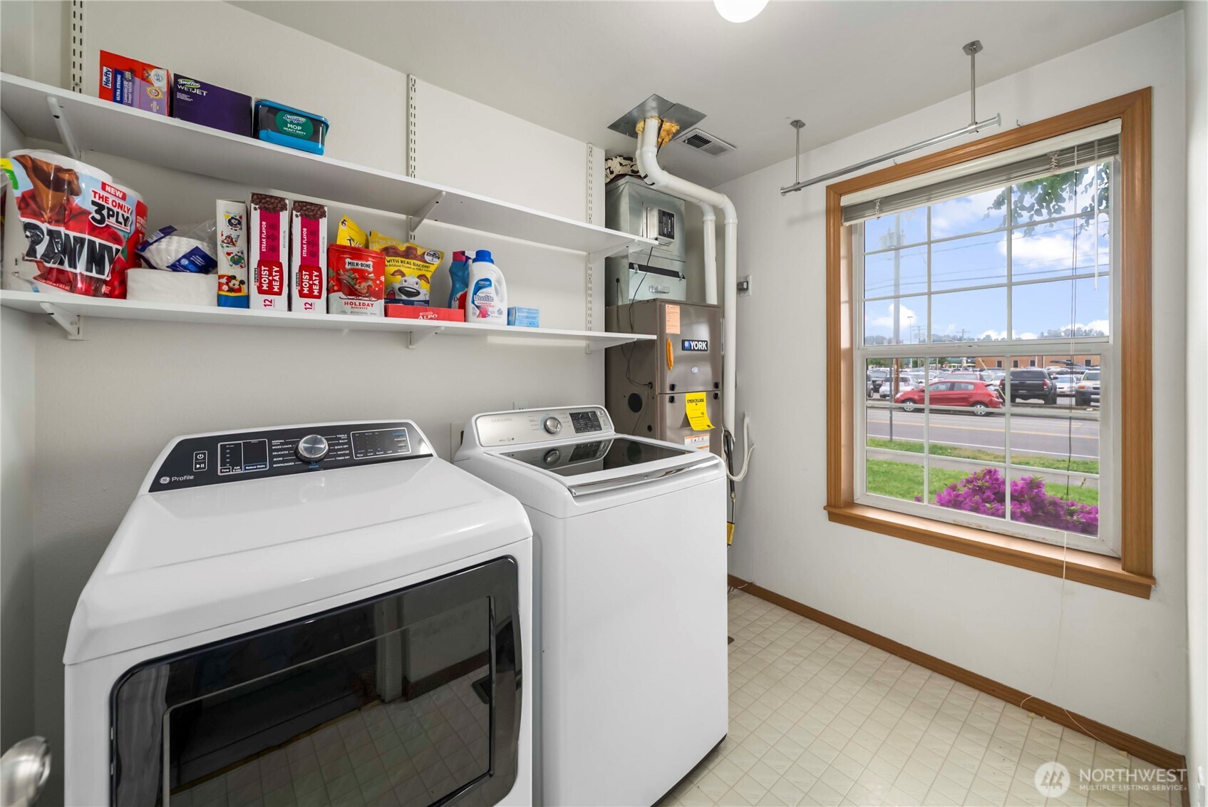 1010 Academy Street Sumner, WA 98390 - Photo 27 of 37 a utility room with stainless steel appliances wooden floor and window