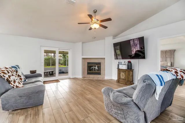 a view of a living room and hardwood floor