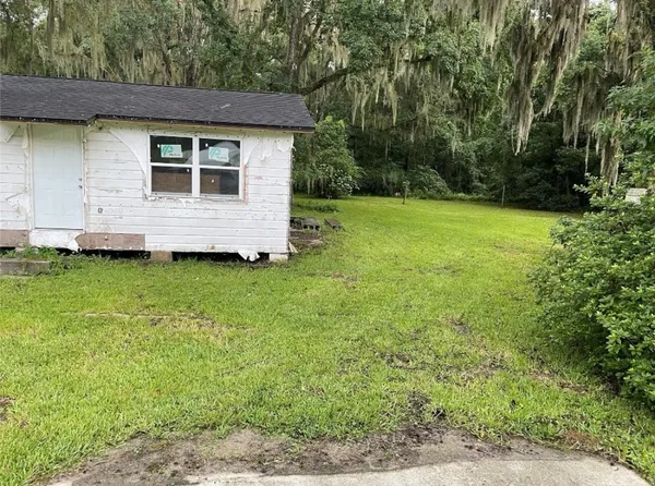 a view of a backyard with a garden
