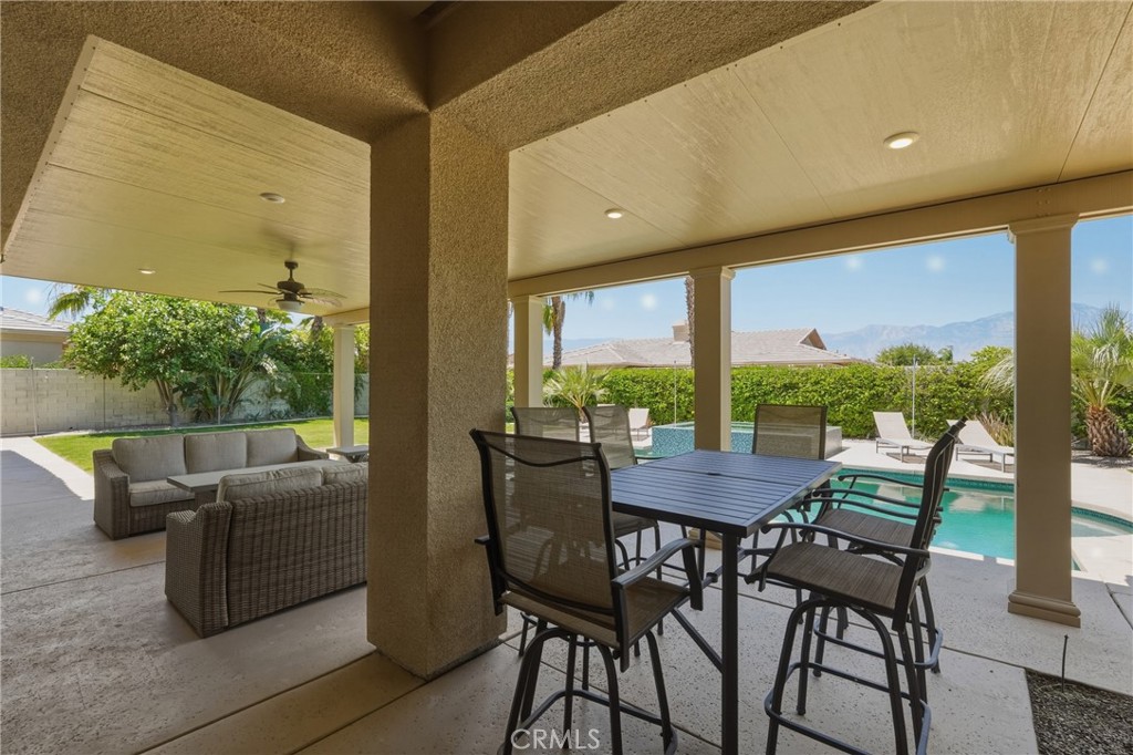 9 Orleans Road Rancho Mirage, CA 92270 - Photo 59 of 71 a view of an outdoor dining space with furniture and garden view