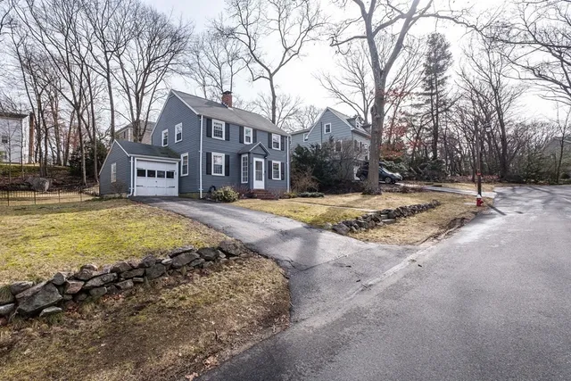 a view of swimming pool with outdoor seating and covered with trees