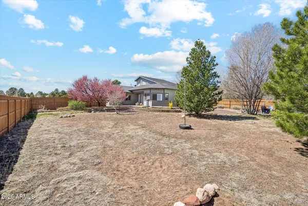 a big house with a big yard and large tree
