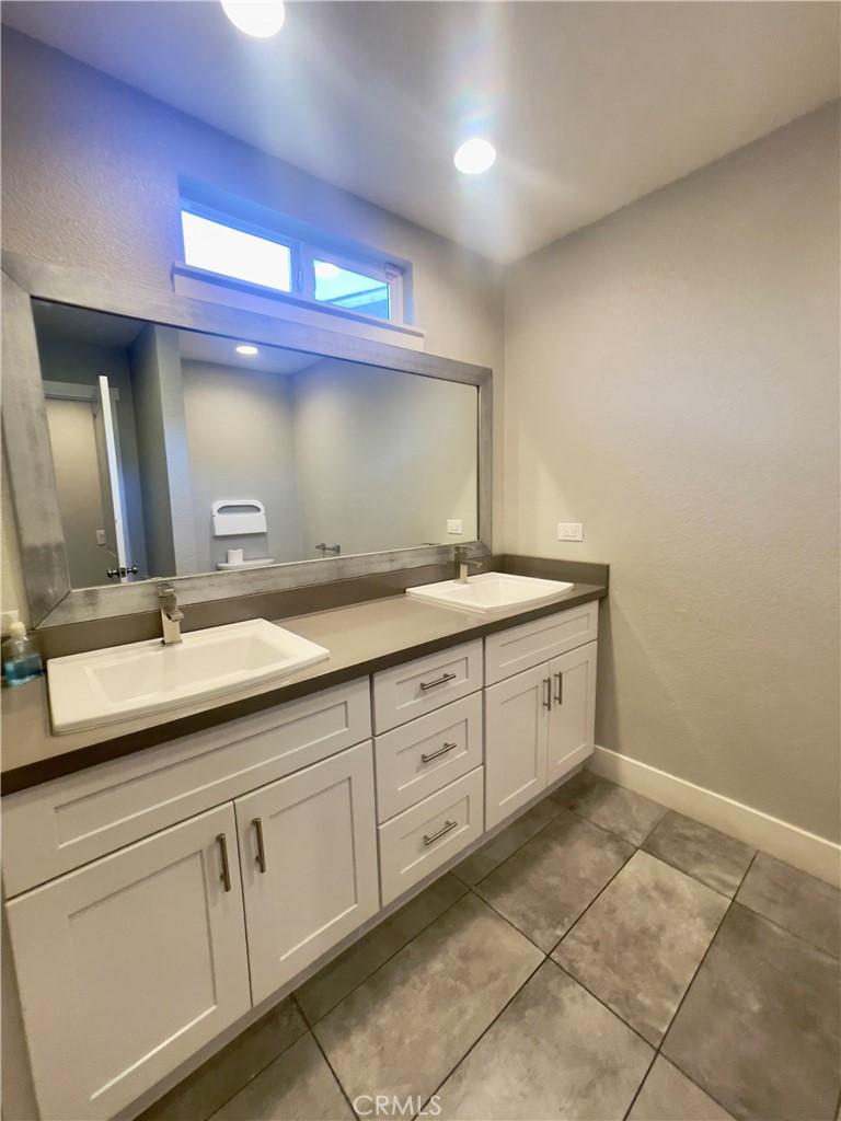 8317 Keyesport Way Citrus Heights, CA 95610 - Photo 12 of 28 a spacious bathroom with a granite countertop sink and a mirror